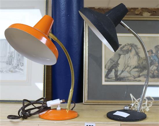 An orange and a black 1960s desk lamp